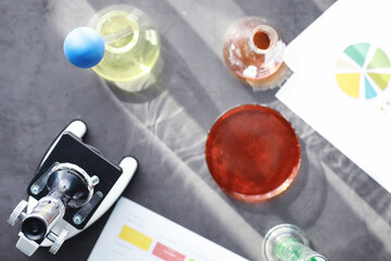 Laboratory research. Drug testing. Chemical experiments in the laboratory. Microscope various test tubes and beakers on the table at the medical officer.