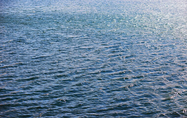 Water surface. The texture of the water. Waves on the lake in windy weather.
