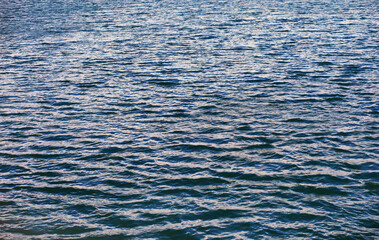 Obraz premium Water surface. The texture of the water. Waves on the lake in windy weather.