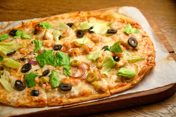 Pizza with bacon and ham and tomatoes