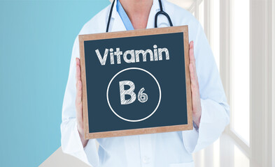 Vitamin B6 - Doctor shows information on blackboard.Doctor holding chalkboard with text.