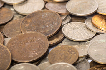 Background of old USSR coins of rubles and kopecks of various denominations. The ruble and kopeck is the national currency of the USSR. Money concept.