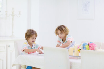 Family playing board game. Kids play.