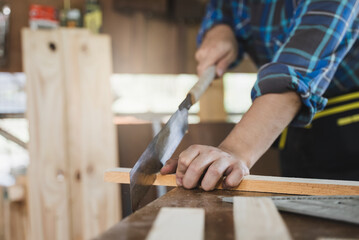 Hands of person doing diy project at home. Man measuring wood to doing cabinet craftworks as a hobby.