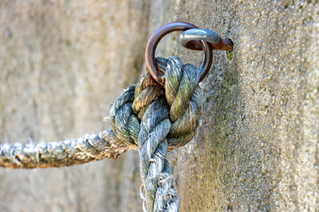 A holder in the rock with a rope as a railing