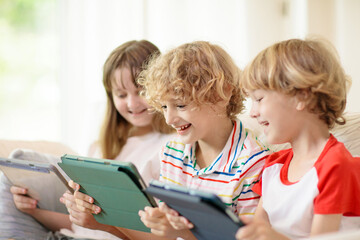 Kids with mobile phone. Child with tablet computer