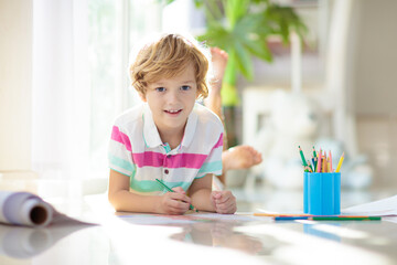 Child drawing. Kid painting rainbow.