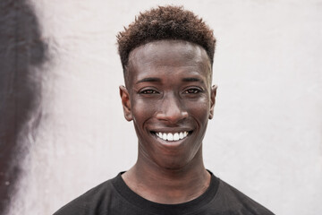 Portrait of young african man smiling on camera