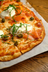 Pizza with bacon and ham and tomatoes