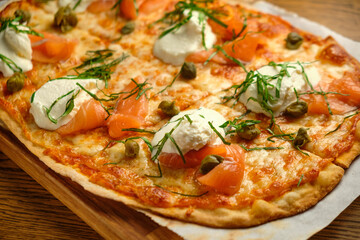 Pizza with bacon and ham and tomatoes