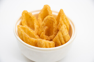 golden cone corn chips isolated on white background, spicy chips