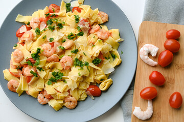 Pasta with shrimps with butter and cherry tomato