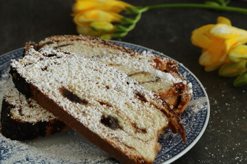 Yellow freesias and homemade slices cake. Romantic coffee time . Selective focus . Still life food stile 