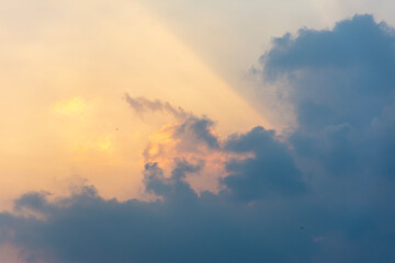 Naklejka na ściany i meble Golden sky after sunset behind the clouds.