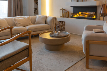 cozy warm home interior of a chic country house with an open plan, wood finishes, warm colors and a family hearth. view of the recreation area for family and guests