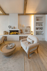 cozy warm home interior of a chic country house with an open plan, wood finishes, warm colors and a family hearth. view of the recreation area for family and guests