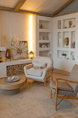 cozy warm home interior of a chic country house with an open plan, wood finishes, warm colors and a family hearth. view of the recreation area for family and guests