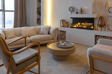 cozy warm home interior of a chic country house with an open plan, wood finishes, warm colors and a family hearth. view of the recreation area for family and guests