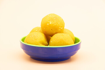 coconut laddoo isolate on colorful background