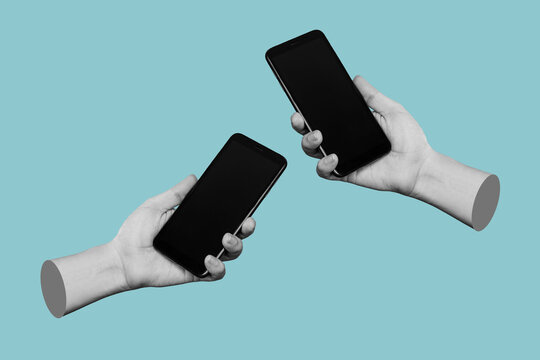 Two hands of women holding mobile phones with blank black screens, empty copy space for design isolated on a blue background. Internet connection, File transfer, information exchange. 3d mockup 