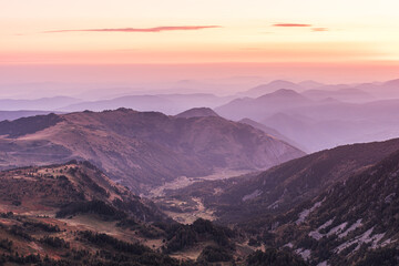 Fototapeta na wymiar Crimson sunrise light on the mountains.