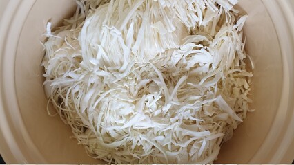 Shredded cabbage in a saucepan