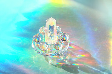 quartz crystal tower and balls on holographic background. Minerals Refracting vivid colors light....