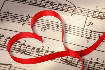 Small red heart with musical notes. Love to study music concept