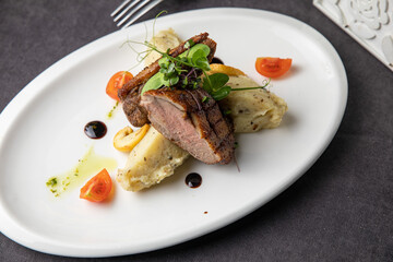 Meat dish in a restaurant on a set table

