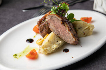 Meat dish in a restaurant on a set table
