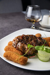 Meat dish in a restaurant on a set table
