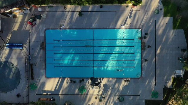 Overhead Topdown Shot Of Athletic Outdoor Pool On A Sunny Day. Aerial