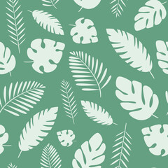 Pattern with different palm leaves on a green background.