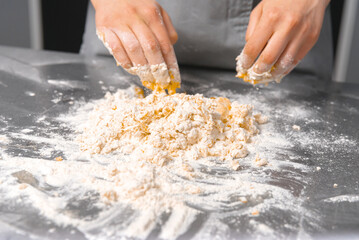 Close up photo of chef preparing dough for pasta carbonara