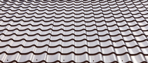 Tiled metal brown roof, texture slope of surface