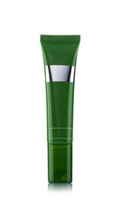 Green plastic tube for cosmetics isolated on a white background.