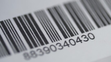 Scanner With Red Laser Scanning a Bar Code on a Product Closeup