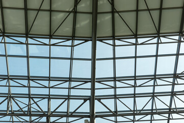 Glass roof with steel structure. Modern ceiling architecture