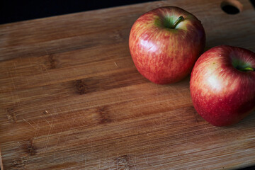 red apples on wooden table