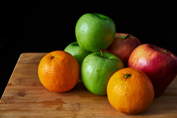 apples and oranges on the table