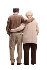 Full length rear shot of an elderly man and woman in embrace