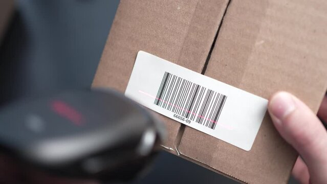 Scanning a Shipping Cardboard Box Bar Code Label Closeup