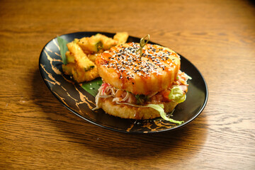 Pumpkin burger with nuts and chickpeas with tomato salsa, spinach