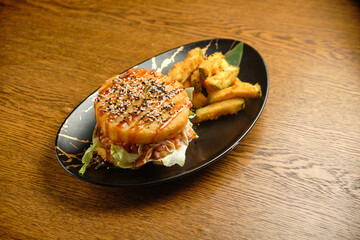 Pumpkin burger with nuts and chickpeas with tomato salsa, spinach
