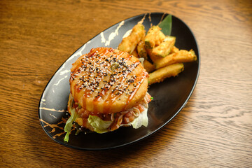 Pumpkin burger with nuts and chickpeas with tomato salsa, spinach