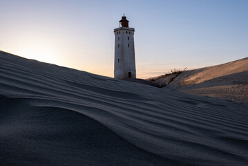 Rubjerg Knude Fyr Lighthouse in the sand dunes in northern denmark north jutland region at sunset - obrazy, fototapety, plakaty