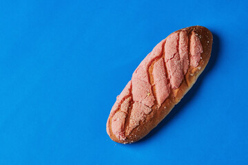 Homemade and traditional sweet bread from Oaxaca. Lunch food. On vibrant blue background. Mexican sweet bread. rich posts.