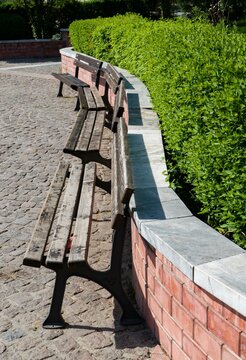 Benches to the wall and boxwood shrubs,leading lines,symmetry