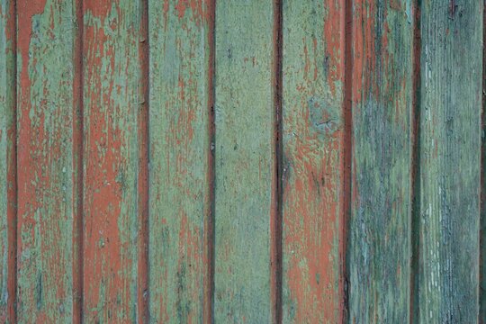Several coats of paint on a wooden door,old and worn out © ceci