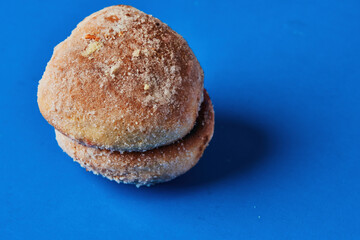 Homemade and traditional sweet bread from Oaxaca. Lunch food. On vibrant blue background. Mexican sweet bread. rich posts.